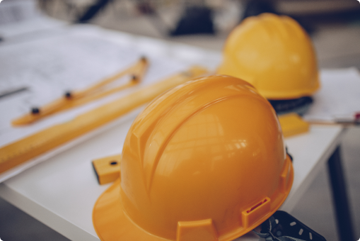 Construction hard hats on table
